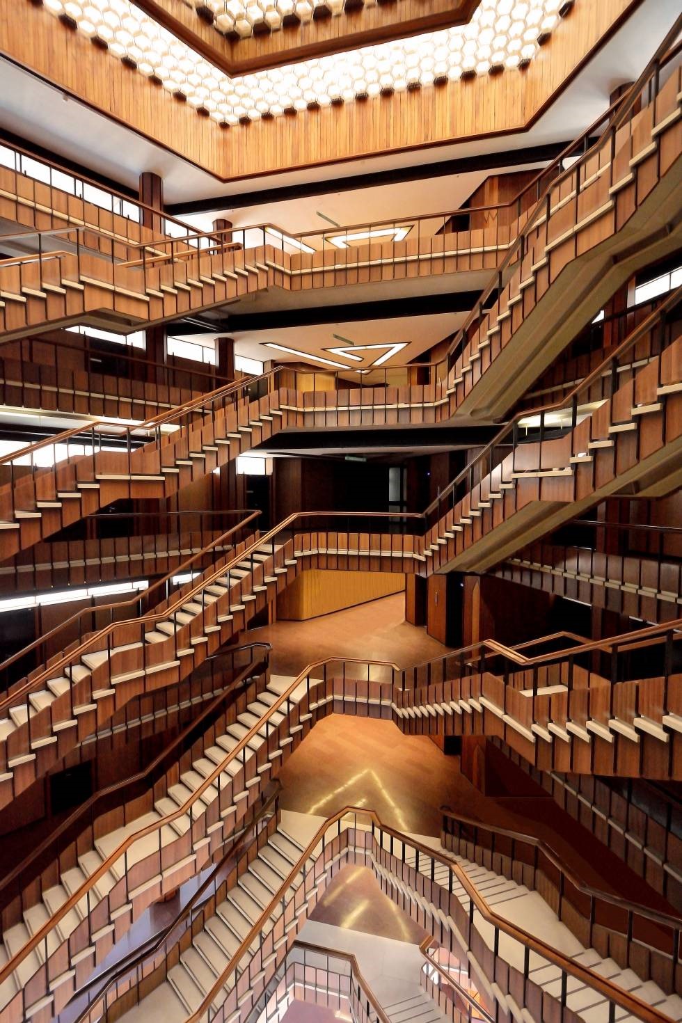 Ivrea city's Palazzo Uffici inside stairs view. UNESCO Worls Heritage Site. Wood and brown palette.